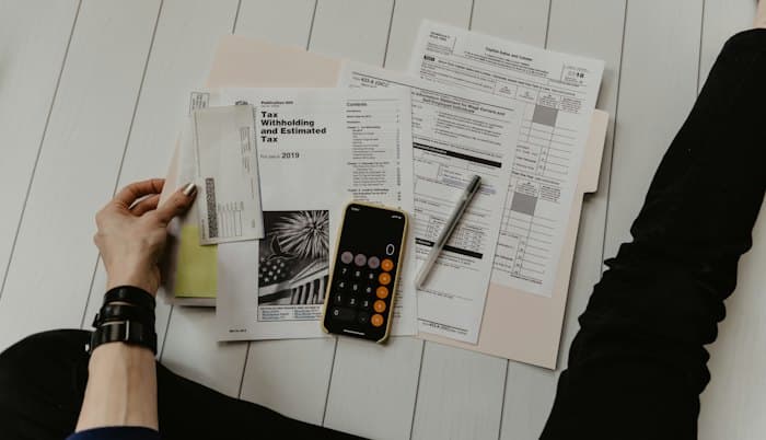 Stack of official forms and documents on a desk